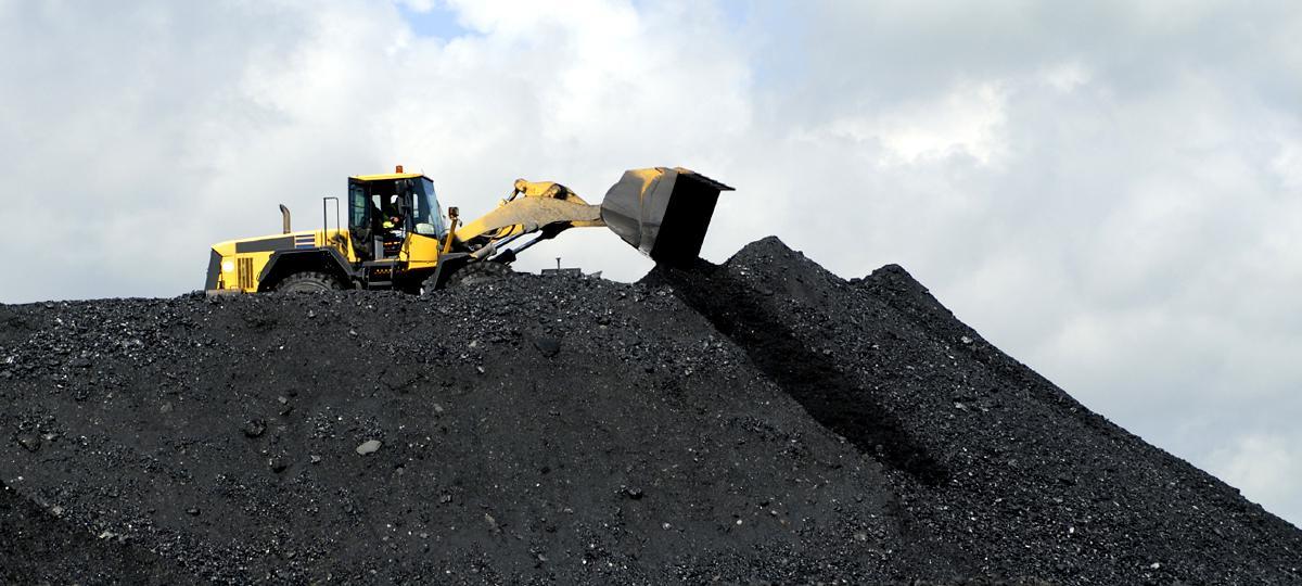 A front end loader working with coal